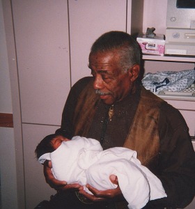 Hicey Ross Jr Holding Granddaughter Christa Loving at Hospital January 1999